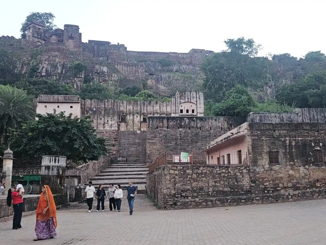Panoramic view of Ranthambore Fort at glance, its stone walls running along a forested hilltop